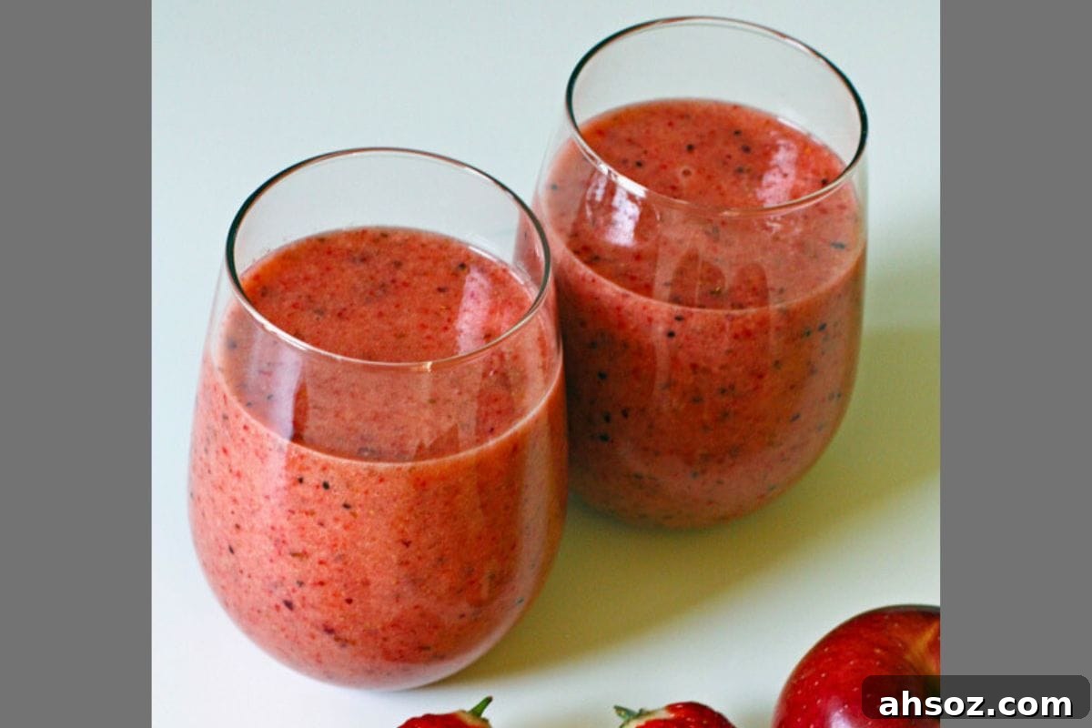 Strawberry kiwi smoothie with apples bananas strawberries and pineapple