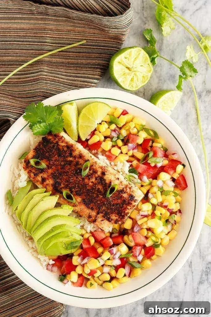 Blackened fish taco bowls with corn salsa, avocado, and hot rice