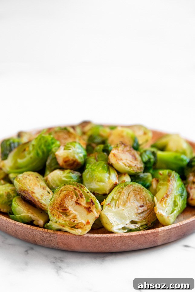 Side shot of a plate of sauteed Brussels sprouts