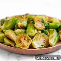 Square photo of a plate of sauteed Brussels sprouts