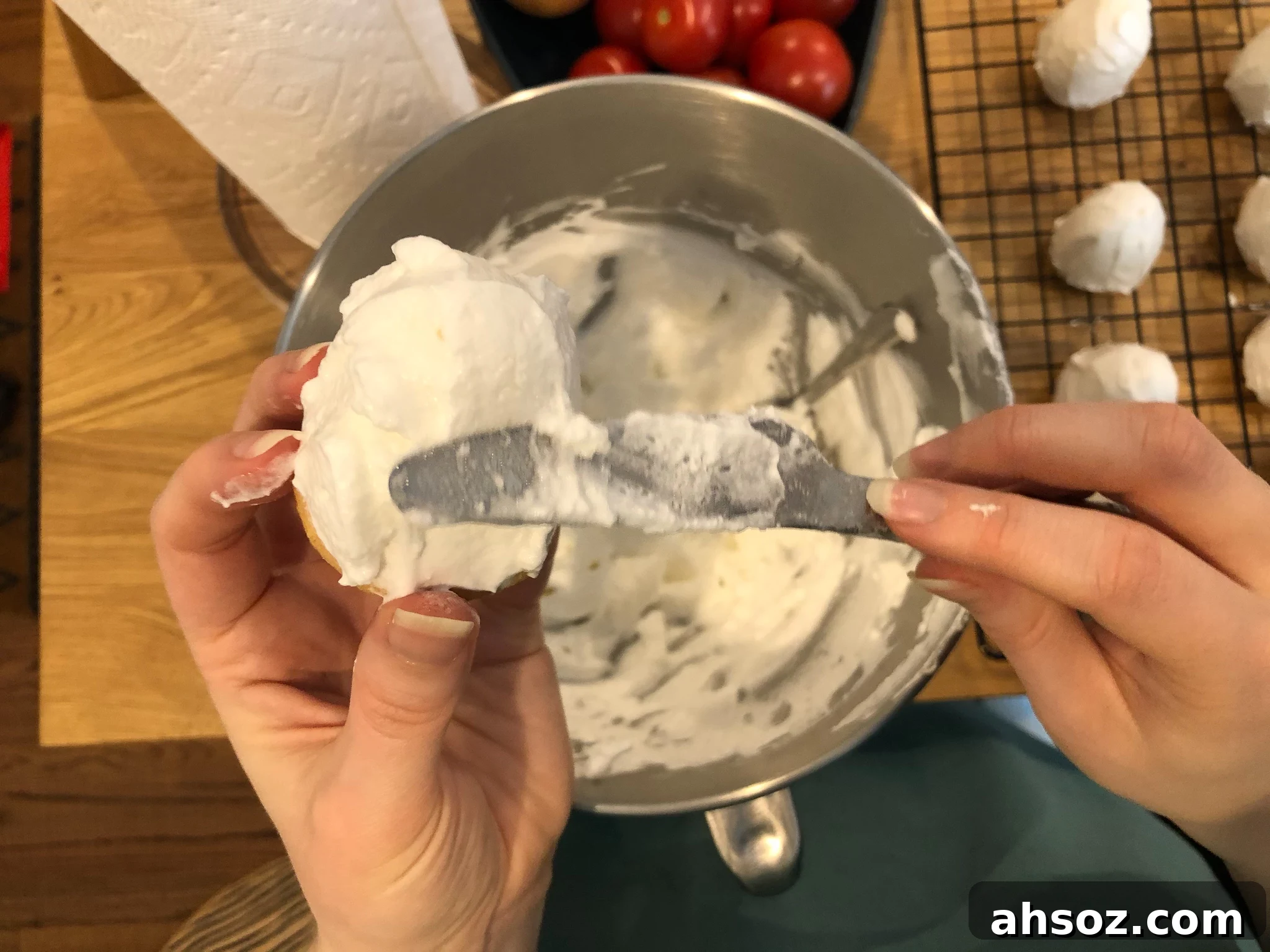 Covering the cookie base in meringue filling.