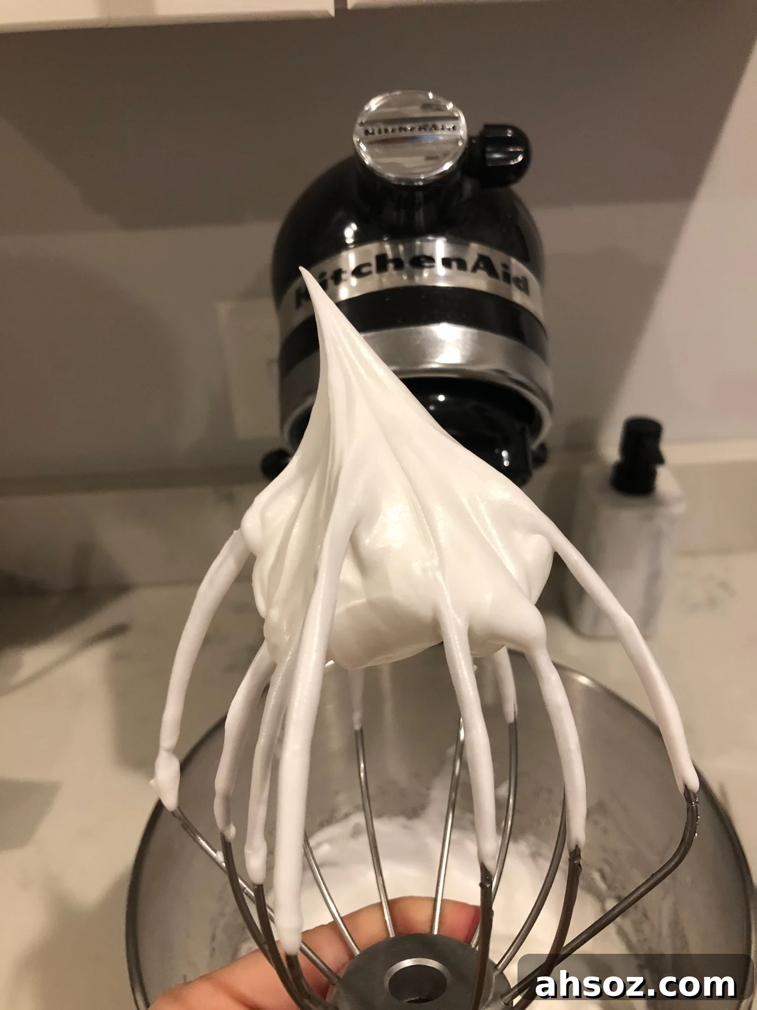 Meringue mixture at stiff peaks.