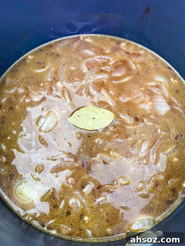 French Onion Soup in an Instant Pot with a bay leaf