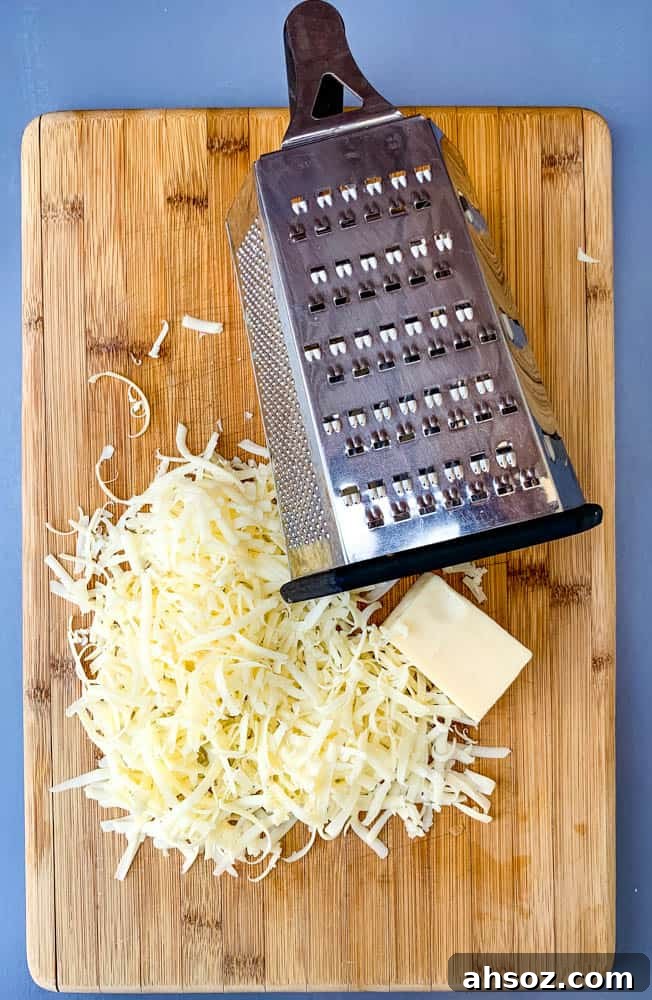 shredded cheese on a cutting board