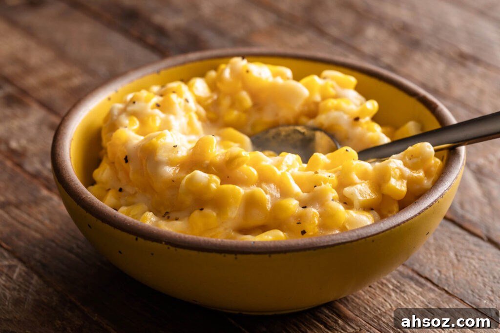 bowl of cream corn with a spoon 