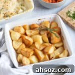 Duck fat roast potatoes in a white dish.