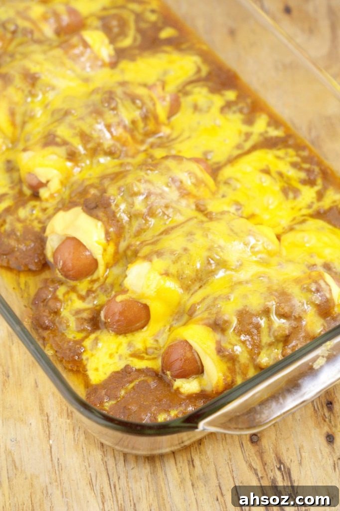 Chili Cheese Dog Casserole Recipe- A quick and easy family dinner idea recipe inspired by chili cheese dogs combined with the comfort and ease of a casserole. OMG. So cheesy!