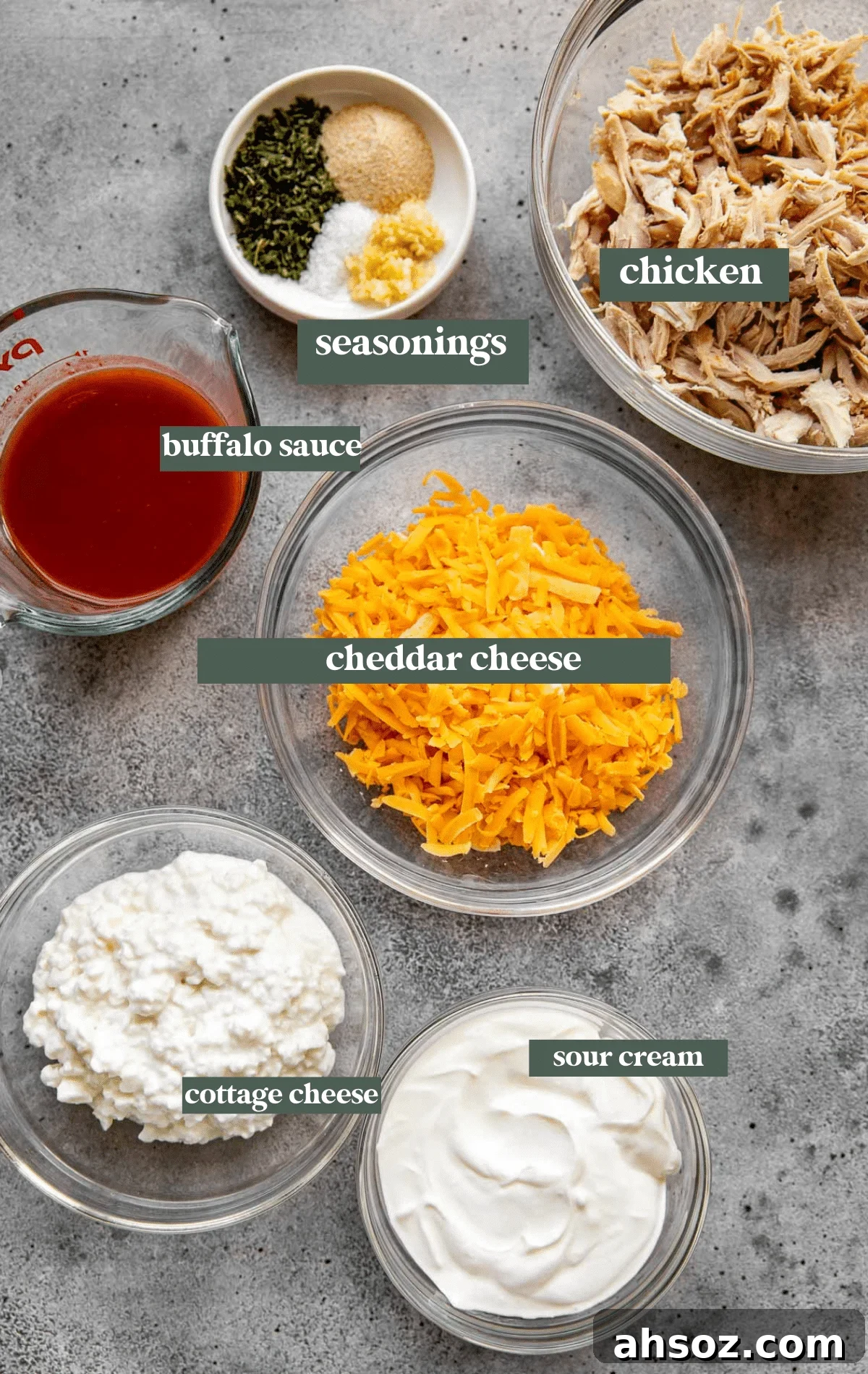 ingredients to make buffalo dip in glass bowls. 