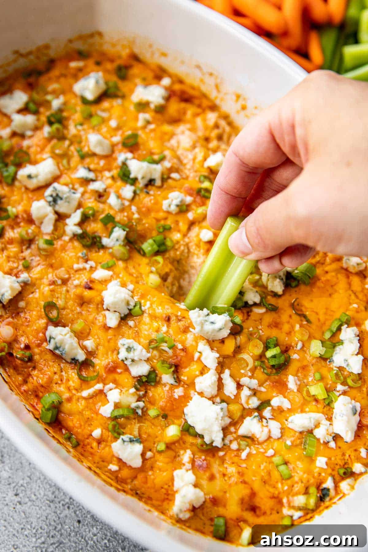 celery scooping into buffalo dip. 