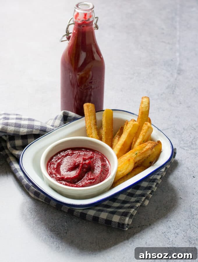 Bottle of Beetroot Ketchup with chips