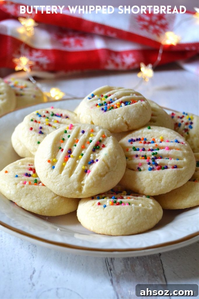 Buttery Whipped Shortbread Cookies That Melt in Your Mouth 2 A white and gold plate filled with buttery whipped shortbread cookies