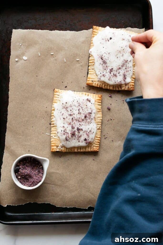 adding sprinkles to homemade pop tarts
