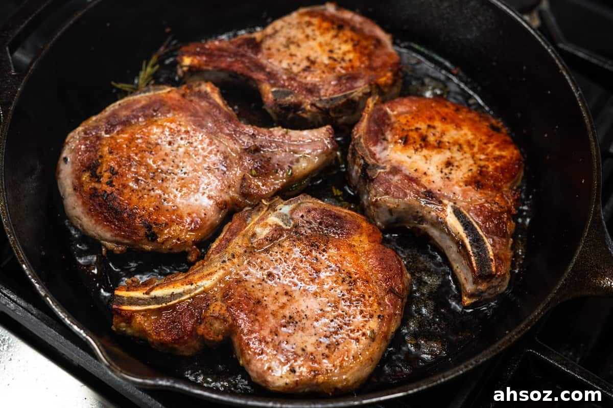 cast iron pork chops ready to serve.