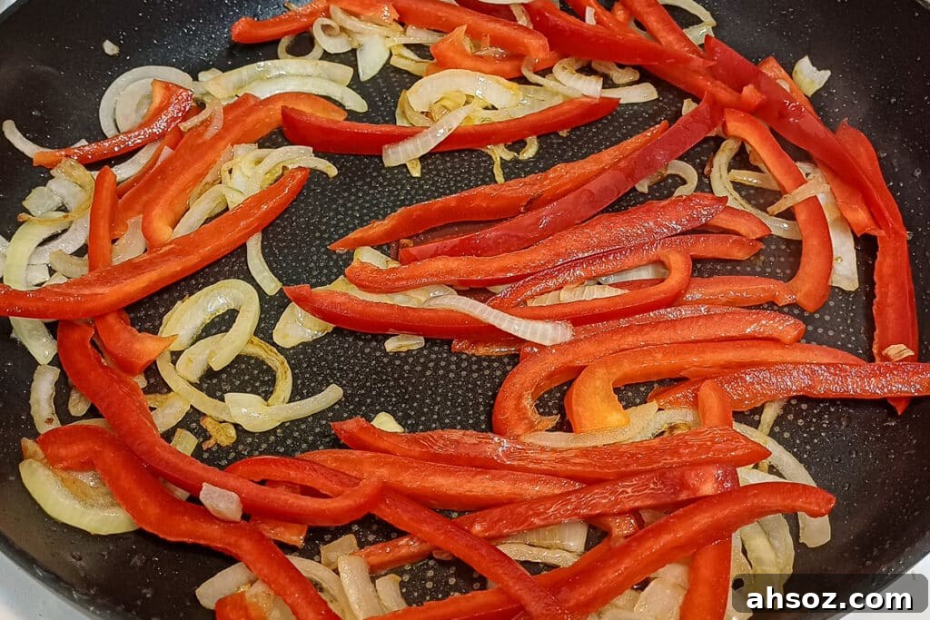 browning onions and capsicum for paprika pork