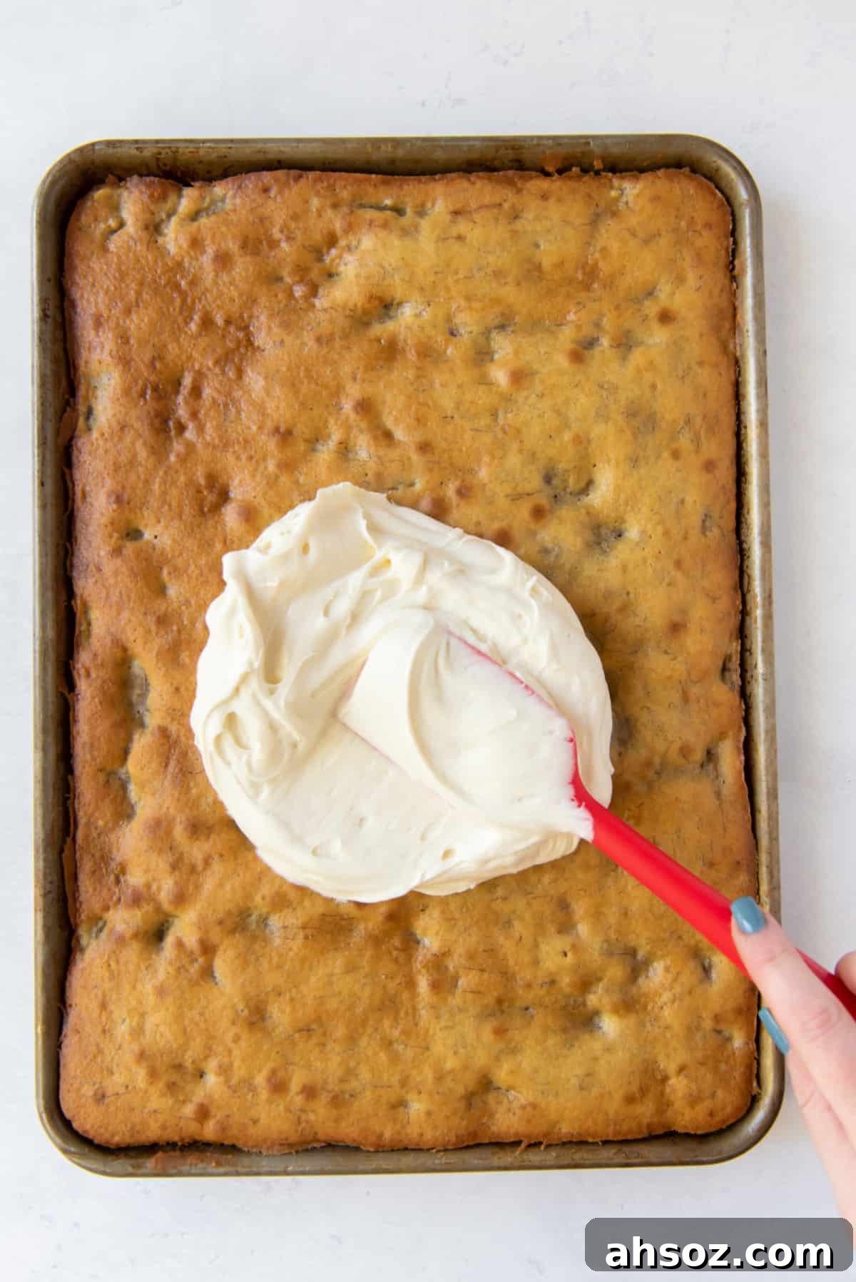 spreading frosting on banana bars