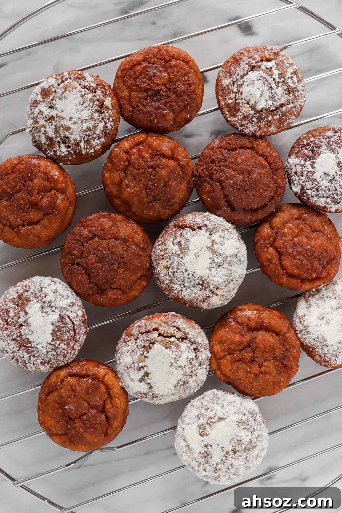 Cinnamon sugar coated donut holes on a cooling rack