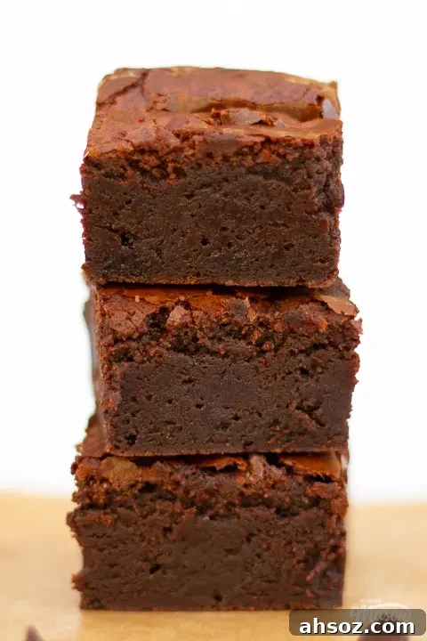 Close up of luxurious chocolate brownies in a stack.