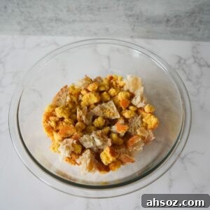 Cornbread and bread crumbled in a bowl.