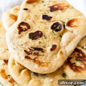 pile of soft naan bread on plate