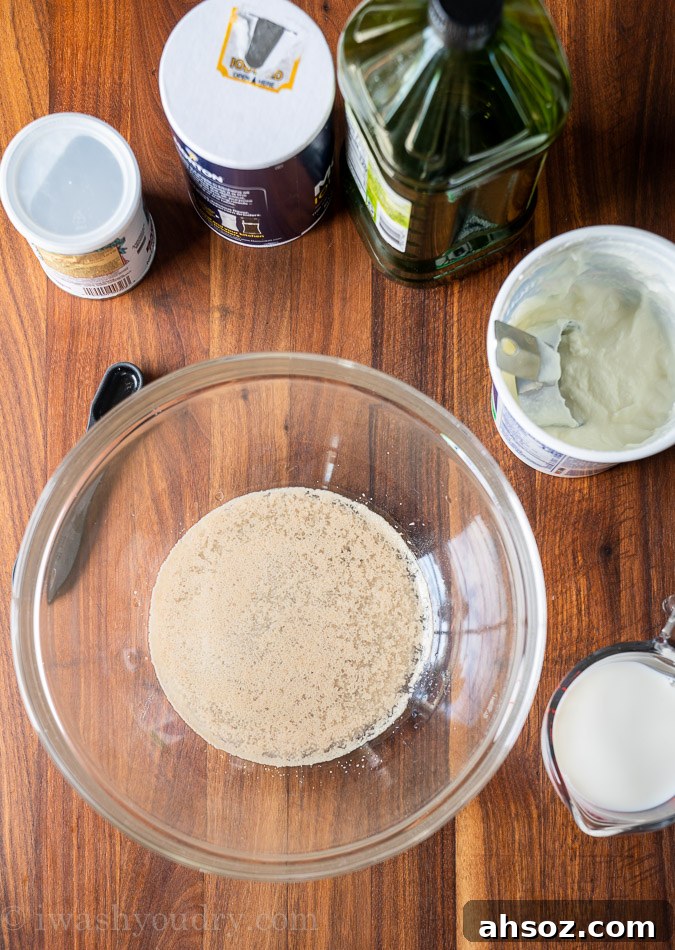 Ingredients needed to make naan bread on wood board