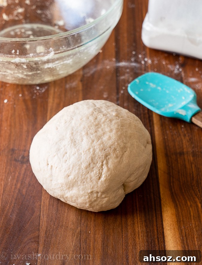 naan dough ball on wood surface