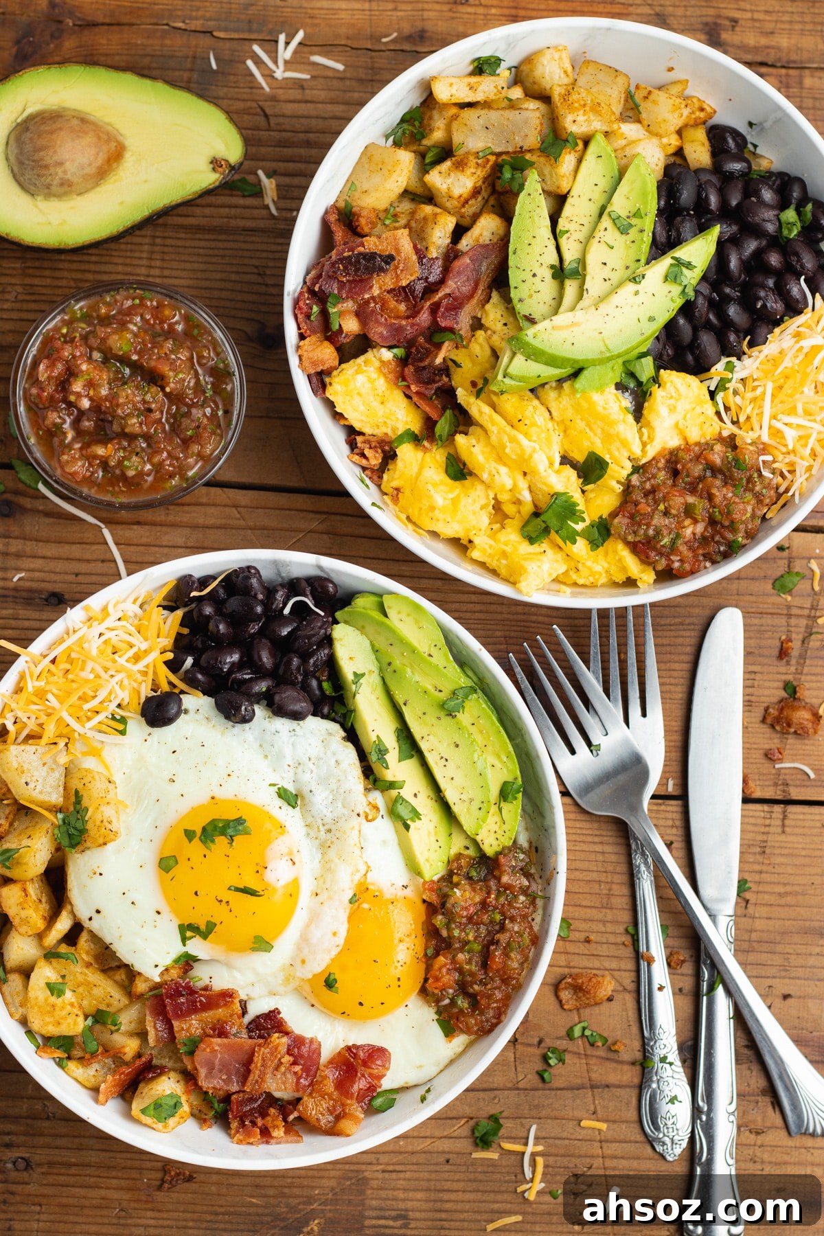 This is a picture of two filled burrito breakfast bowls.