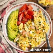 This is a square picture of a plate with smoked salmon breakfast scramble.