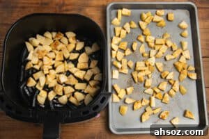 This is a picture of potatoes being cooked with two methods, in an air fryer and on a baking sheet for the oven.