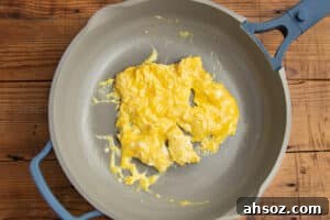 This is a picture of scrambled eggs in a skillet.