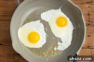 This is a picture of sunny side up eggs in a skillet.
