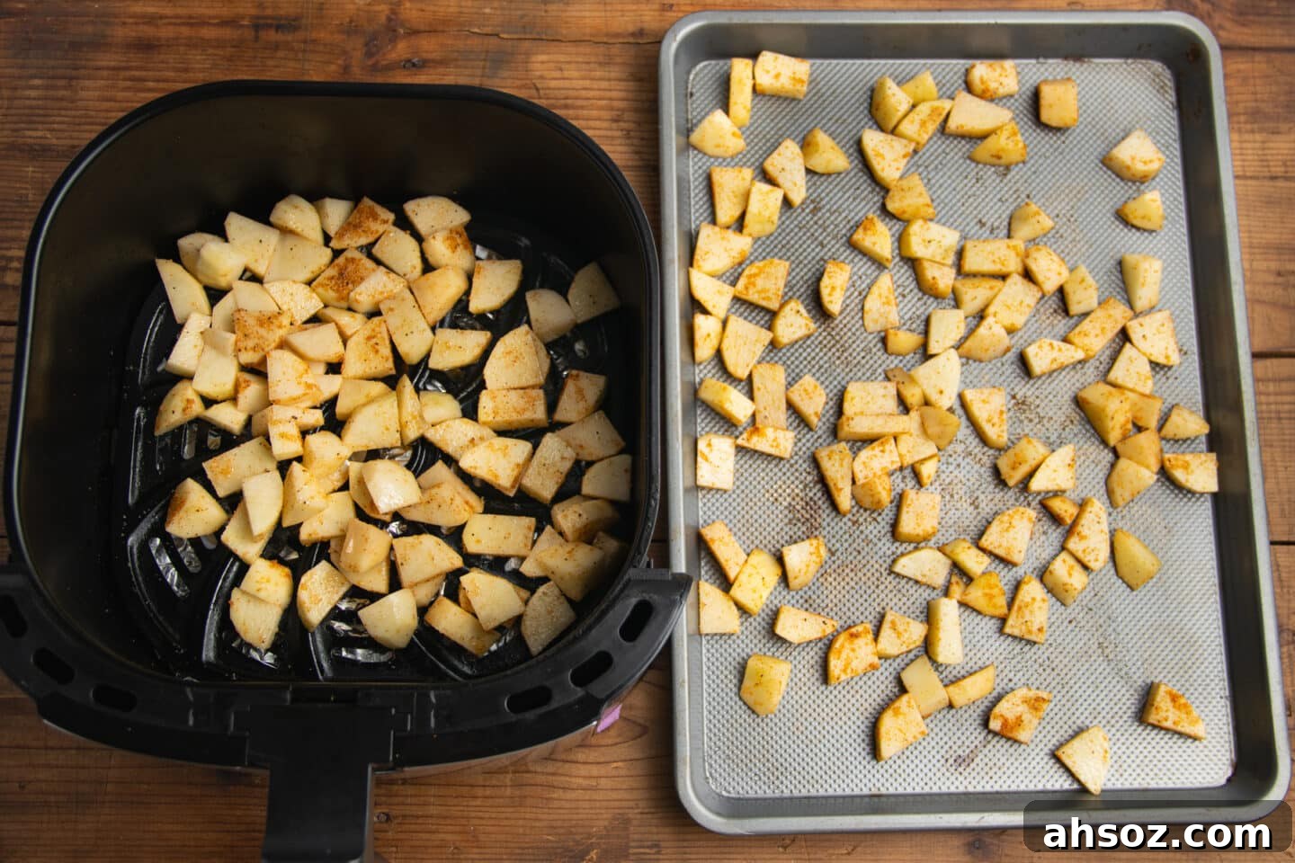 This is a picture of potatoes being cooked with two methods, in an air fryer and on a baking sheet for the oven.