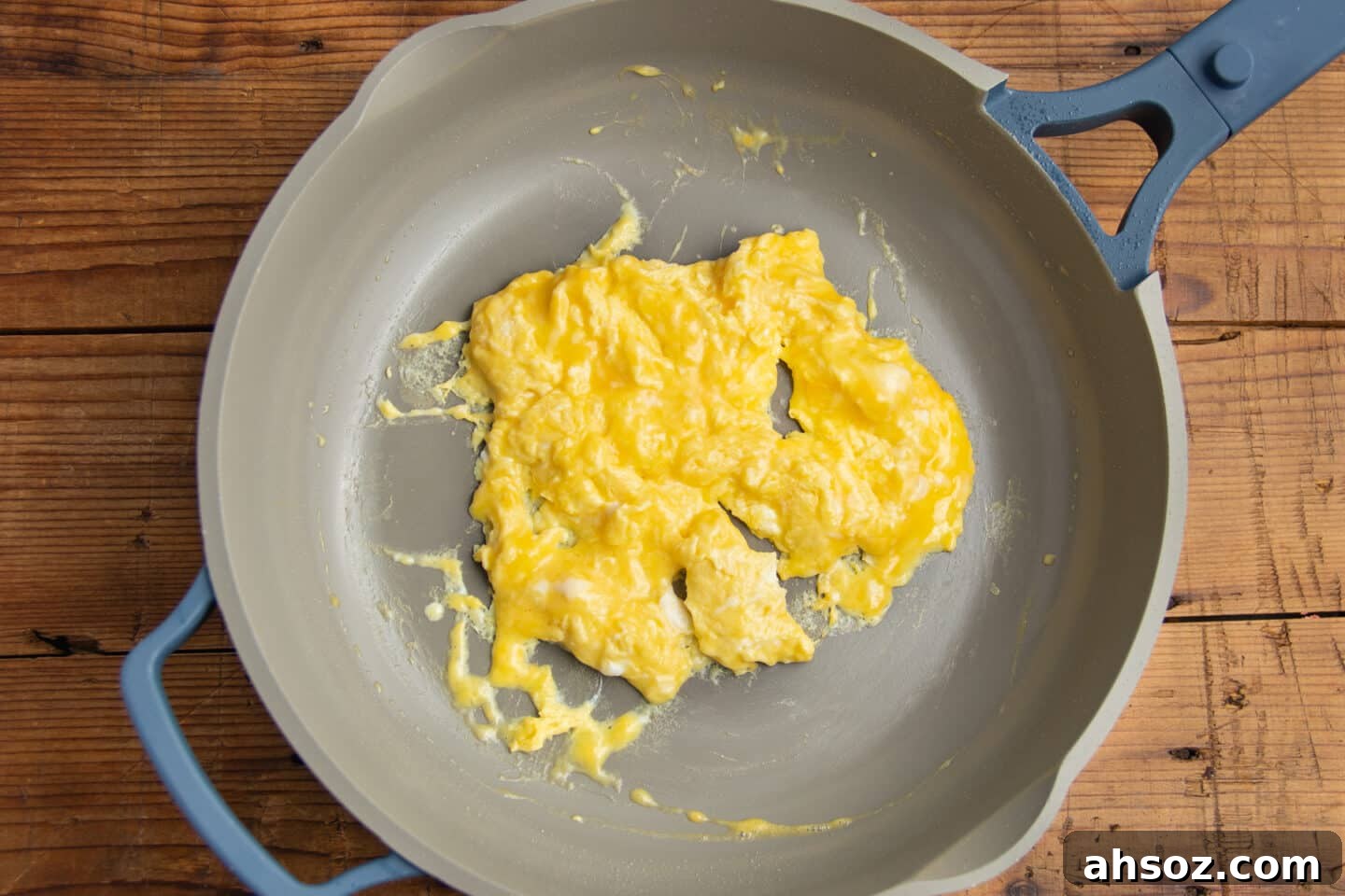 This is a picture of scrambled eggs in a skillet.