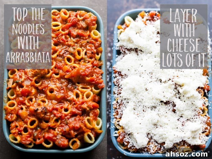 Pasta layered with cheese and sauce in a baking dish.