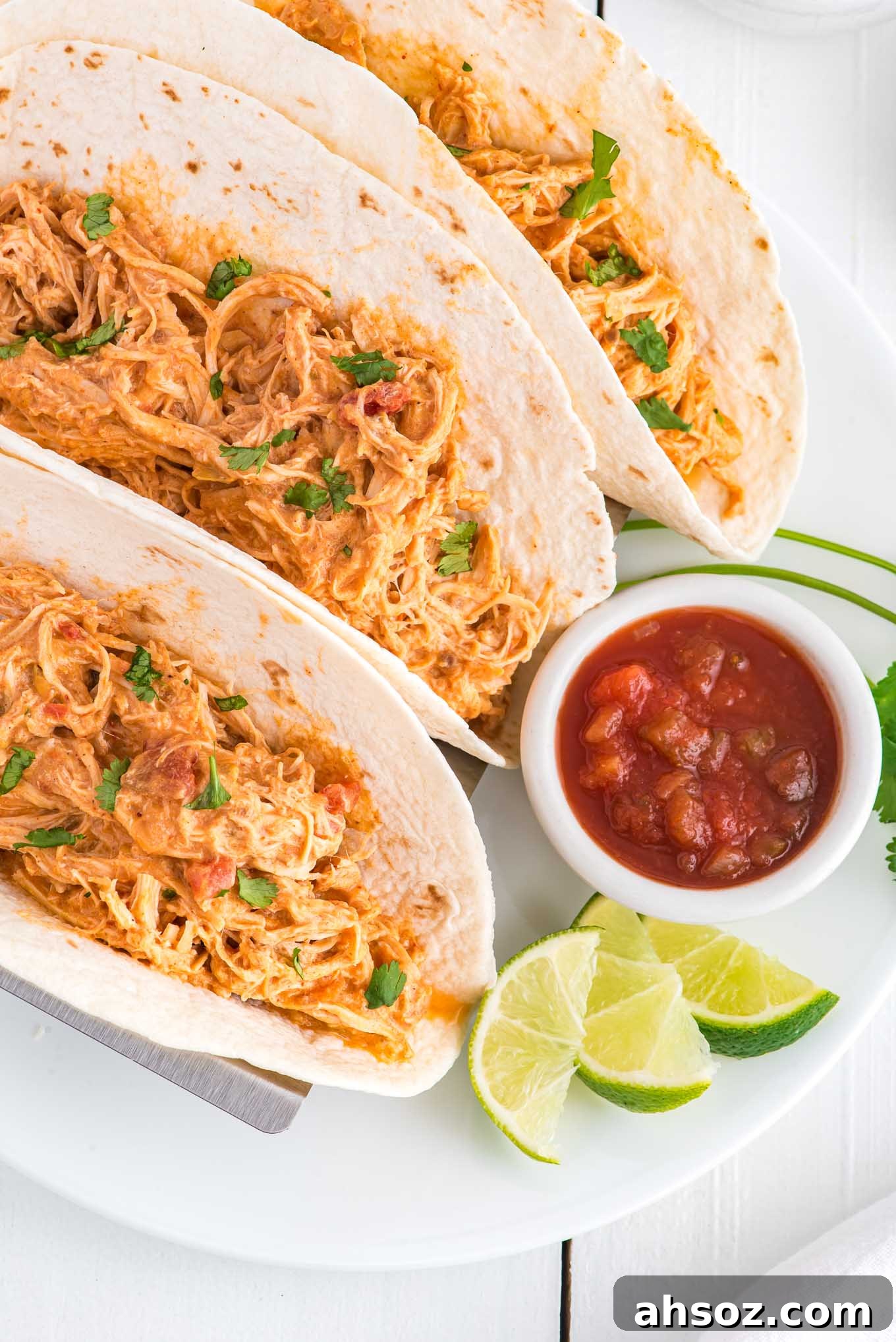 Crockpot salsa chicken in tortillas.