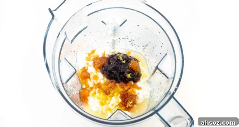 Ingredients in a blender for blueberry cottage cheese ice cream.