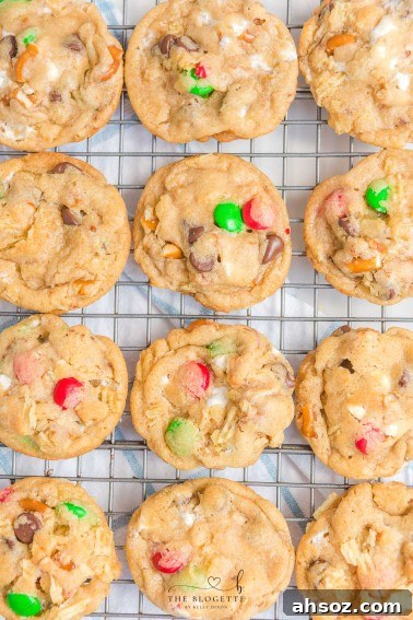 Kitchen Sink Christmas Cookies with candy, chocolate chips, pretzels, marshmallows, and potato chips