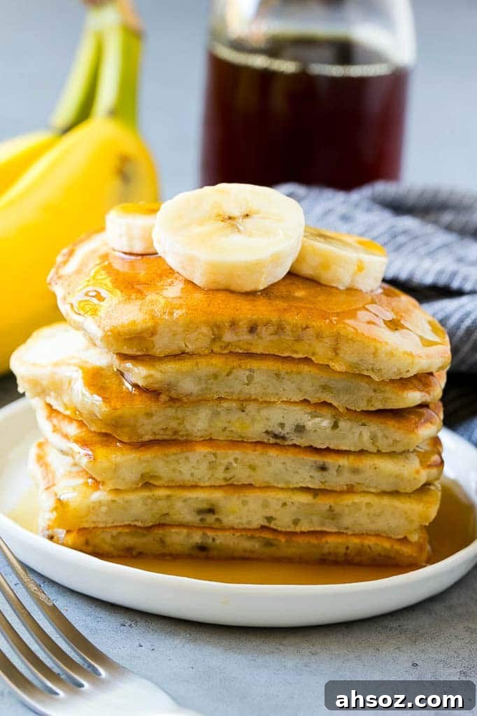 A cross section of a stack of banana pancakes.