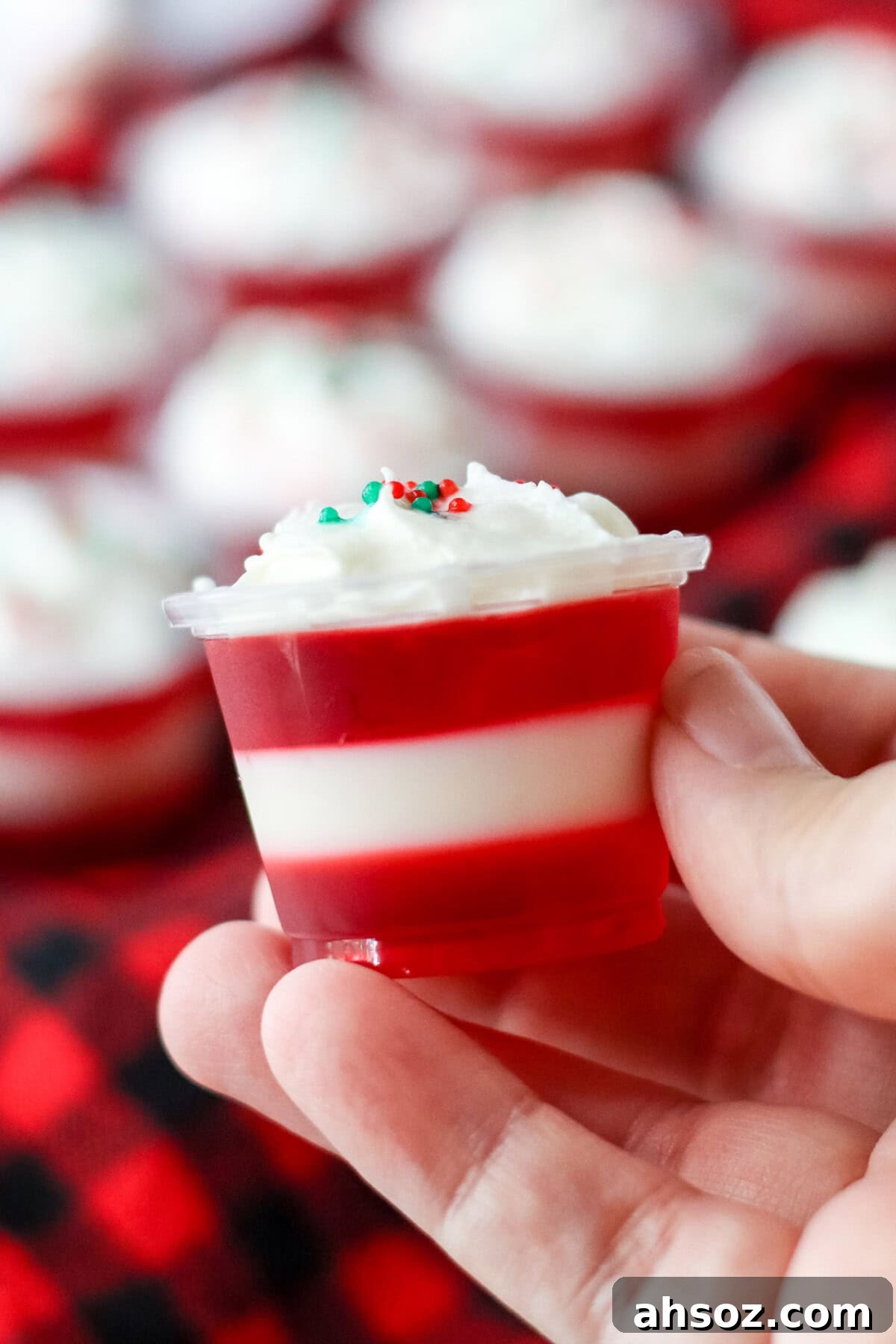 holding a Candy Cane Jello Shot