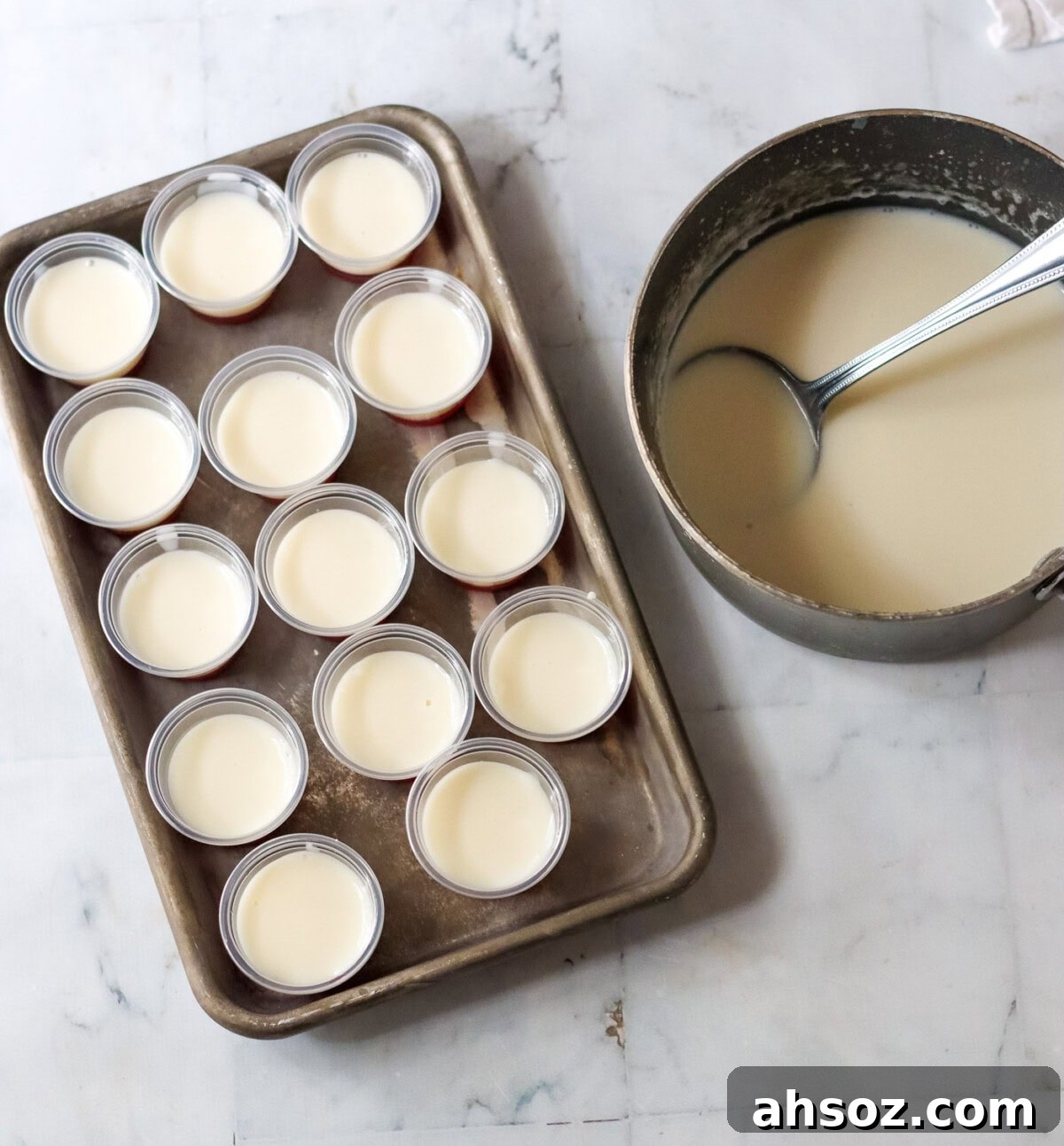 candy cane jello shots with sweetened condensed milk on a tray