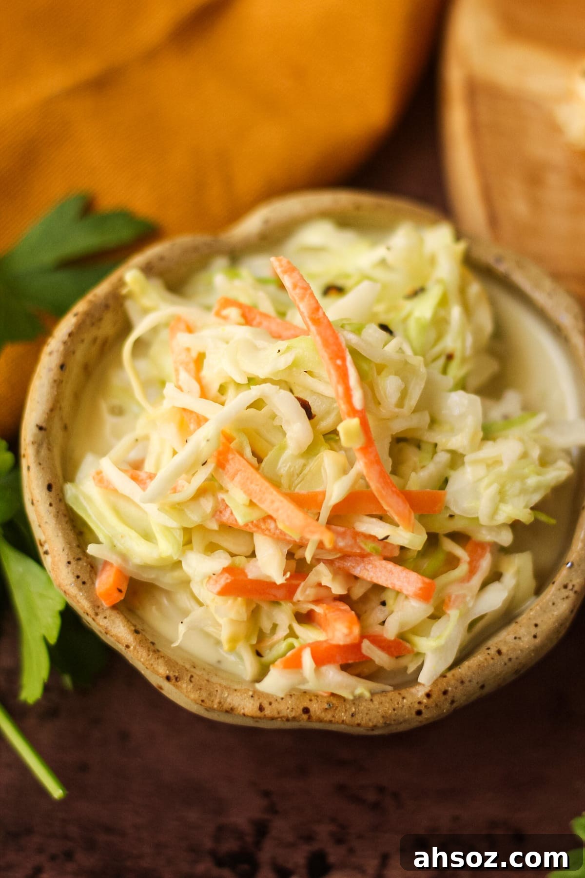 creamy southern coleslaw in a brown bowl