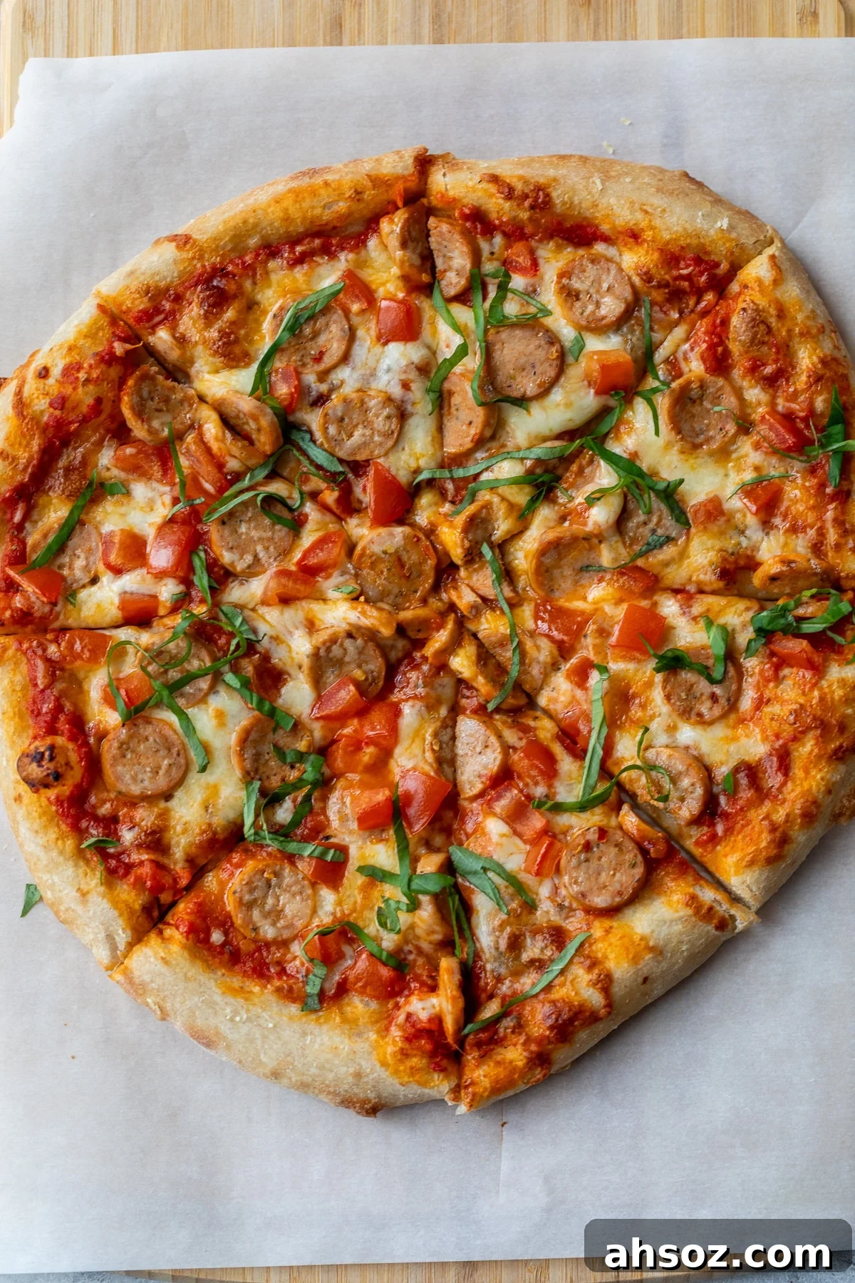 chicken sausage pizza sliced into 8 pieces